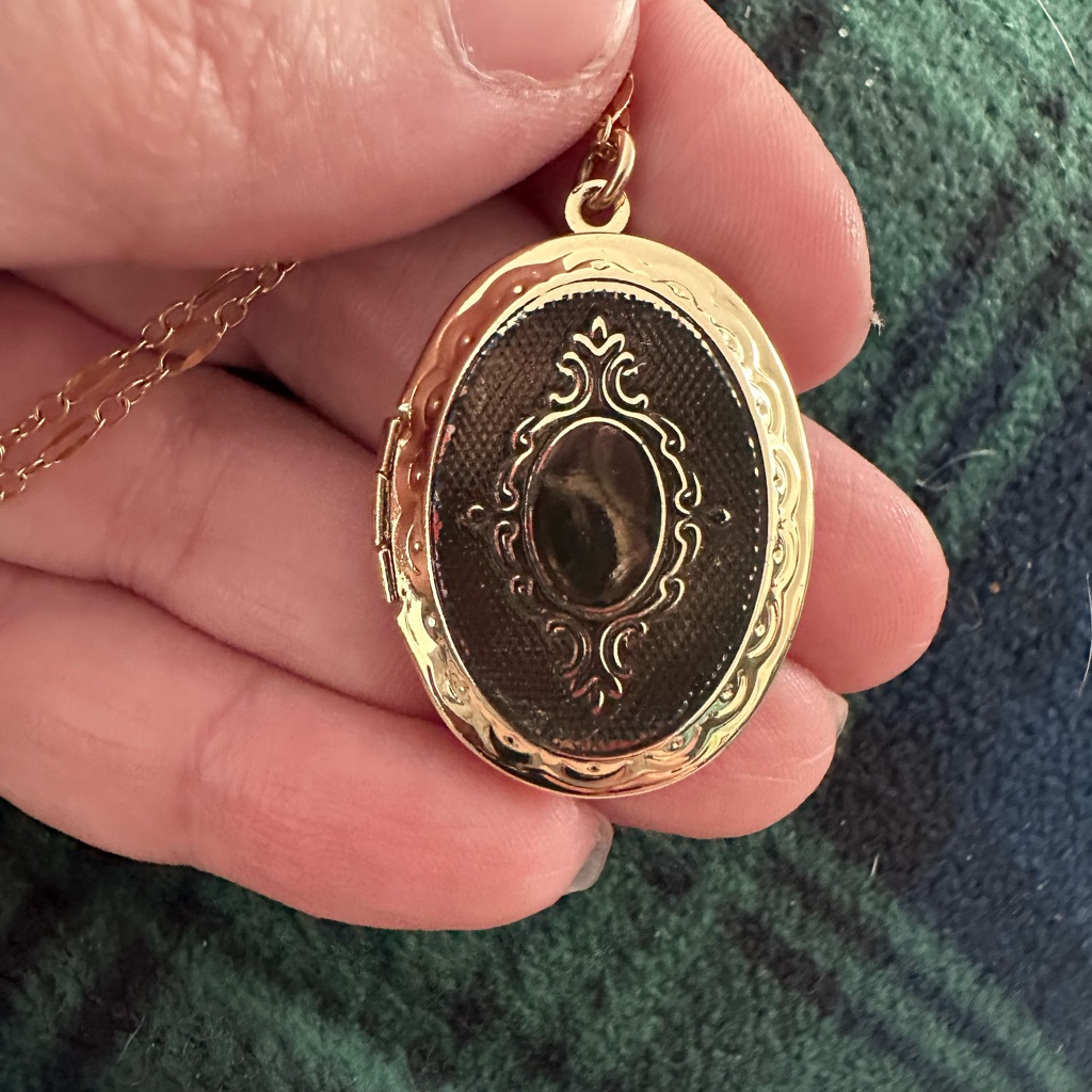 Elegant Gold And Black Locket Necklace